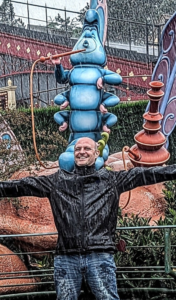 Richard Combes, being rained on at DisneyLand Paris